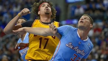 Mar 16, 2014; Los Angeles, CA, USA; Cleveland Cavaliers center Anderson Varejao (17) and Los Angeles Clippers forward Blake Griffin (32) tangle under the hoop during first quarter action at Staples Center. Mandatory Credit: Robert Hanashiro-USA TODAY Sports
