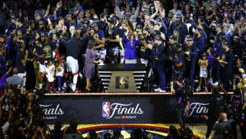 Denver Nuggets owner Stan Kroenke raises the Larry O'Brien Championship Trophy (Photo by Justin Edmonds/Getty Images)