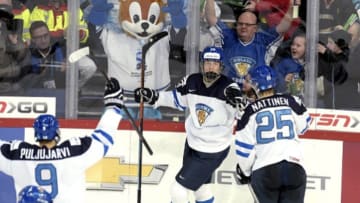 Finland's Patrik Laine (C) celebrates his game winning goal 5-4 with Jesse Puljujarvi and Julius Nättinen (R) during the 2016 IIHF World Junior U20 Ice Hockey Championships tournament match Finland vs Czech Republic in Helsinki, Finland on December 31, 2015. / AFP / Lehtikuva / Markku Ulander / RESTRICTED TO EDITORIAL USE (Photo credit should read MARKKU ULANDER/AFP/Getty Images)