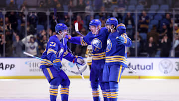 Mar 23, 2022; Buffalo, New York, USA; Buffalo Sabres right wing Alex Tuch (89) celebrates his game winning shootout goal with defenseman Rasmus Dahlin (26) and defenseman Mattias Samuelsson (23) against the Pittsburgh Penguins at KeyBank Center. Mandatory Credit: Timothy T. Ludwig-USA TODAY Sports