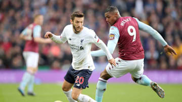 BIRMINGHAM, ENGLAND - NOVEMBER 02: Adam Lallana of Liverpool turns with the ball under pressure from Wesley of Aston Villa during the Premier League match between Aston Villa and Liverpool FC at Villa Park on November 02, 2019 in Birmingham, United Kingdom. (Photo by Marc Atkins/Getty Images)