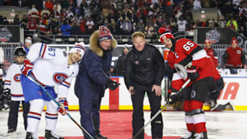OTTAWA, ON: Guy Lafleur and Daniel Alfredsson participate in the ceremonial puck drop, along with Max Pacioretty #67 and Erik Karlsson #65, prior to the 2017 Scotiabank NHL100 Classic between the Ottawa Senators and the Montreal Canadiens at Lansdowne Park on December 16, 2017 in Ottawa, Canada. (Photo by Andre Ringuette/NHLI via Getty Images)