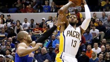 Apr 12, 2016; Indianapolis, IN, USA; Indiana Pacers forward Paul George (13) takes a shot against New York Knicks guard Arron Affalo (4) at Bankers Life Fieldhouse. Mandatory Credit: Brian Spurlock-USA TODAY Sports