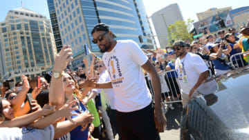 OAKLAND, CA - JUNE 12: Kevin Durant #35 of the Golden State Warriors high fives fans during the Golden State Warriors Victory Parade on June 12, 2018 in Oakland, California. NOTE TO USER: User expressly acknowledges and agrees that, by downloading and/or using this photograph, user is consenting to the terms and conditions of Getty Images License Agreement. Mandatory Copyright Notice: Copyright 2018 NBAE (Photo by Noah Graham/NBAE via Getty Images)