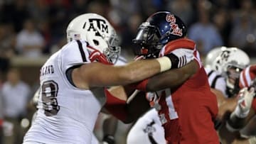 Oct 24, 2015; Oxford, MS, USA; Texas A&M Aggies offensive lineman Keaton Sutherland (78) and Mississippi Rebels defensive end Marquis Haynes (27) during the game at Vaught-Hemingway Stadium. Mississippi Rebels beat Texas A&M Aggies 23-3. Mandatory Credit: Justin Ford-USA TODAY Sports
