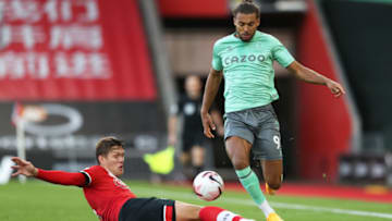 SOUTHAMPTON, ENGLAND - OCTOBER 25: Dominic Calvert-Lewin of Everton is challenged by Jannick Vestergaard of Southampton during the Premier League match between Southampton and Everton at St Mary's Stadium on October 25, 2020 in Southampton, England. Sporting stadiums around the UK remain under strict restrictions due to the Coronavirus Pandemic as Government social distancing laws prohibit fans inside venues resulting in games being played behind closed doors. (Photo by Naomi Baker/Getty Images)