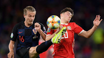 CARDIFF, WALES - OCTOBER 13: Daniel James of Wales is beaten to the ball by Tin Jedvaj of Croatia during the UEFA Euro 2020 qualifier between Wales and Croatia at Cardiff City Stadium on October 13, 2019 in Cardiff, Wales. (Photo by Alex Davidson/Getty Images)