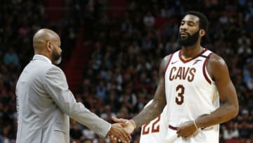 Cleveland Cavaliers head coach J.B. Bickerstaff high-fives Cleveland center Andre Drummond. (Photo by Michael Reaves/Getty Images)