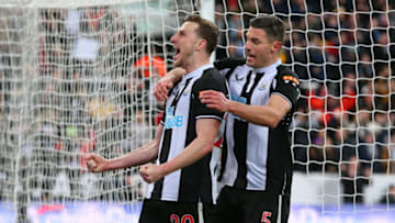 NEWCASTLE UPON TYNE, ENGLAND - APRIL 08: Chris Wood of Newcastle United celebrates with Fabian Scha after scoring the opening goal from the penalty spot during the Premier League match between Newcastle United and Wolverhampton Wanderers at St. James Park on April 08, 2022 in Newcastle upon Tyne, England. (Photo by Alex Livesey - Danehouse/Getty Images)