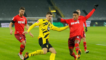 Dortmund's Belgian midfielder Thomas Meunier and Cologne's German defender Ismail Jakobs vie for the ball during the German first division Bundesliga football match BVB Borussia Dortmund v 1.FC Cologne at the Signal Iduna Park Stadium in Dortmund, western Germany, on November 28, 2020. (Photo by LEON KUEGELER / POOL / AFP) / DFL REGULATIONS PROHIBIT ANY USE OF PHOTOGRAPHS AS IMAGE SEQUENCES AND/OR QUASI-VIDEO (Photo by LEON KUEGELER/POOL/AFP via Getty Images)