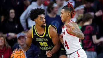 Cincinnati Bearcats guard Jeremiah Davenport defends South Florida Bulls at Fifth Third Arena. Getty Images.