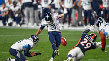 DENVER, CO - SEPTEMBER 14: Stephen Gostkowski #3 of the Tennessee Titans kicks a go-ahead fourth quarter field goal as Brett Kern #6 holds and Bryce Callahan #29 of the Denver Broncos covers the play during a game at Empower Field at Mile High on September 14, 2020 in Denver, Colorado. (Photo by Dustin Bradford/Getty Images)