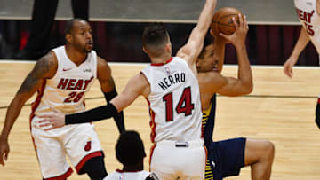Indiana Pacers guard Malcolm Brogdon (7) goes up for a shot past Miami Heat guard Tyler Herro (14)(Jim Rassol-USA TODAY Sports)