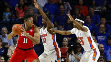 Jan 3, 2017; Gainesville, FL, USA; Florida Gators forward Kevarrius Hayes (13) and forward Justin Leon (23) defend Mississippi Rebels forward Sebastian Saiz (11) in the first half at Exactech Arena at the Stephen C. O