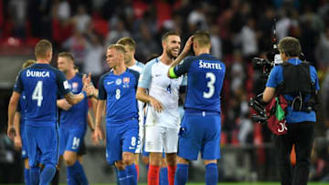LONDON, ENGLAND - SEPTEMBER 04: Jordan Henderson of England and Martin Skrtel of Slovakia in discussion after the FIFA 2018 World Cup Qualifier between England and Slovakia at Wembley Stadium on September 4, 2017 in London, England. (Photo by Mike Hewitt/Getty Images)