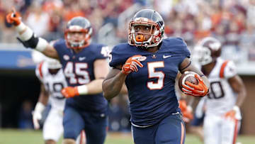 Nov 28, 2015; Charlottesville, VA, USA; Virginia Cavaliers running back Albert Reid (5) carries the ball to score a touchdown against the Virginia Tech Hokies in the third quarter at Scott Stadium. The Hokies won 23-20. Mandatory Credit: Geoff Burke-USA TODAY Sports