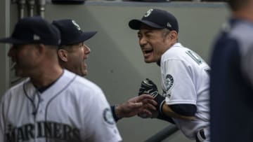 SEATTLE, WA - MAY 3: Ichiro Suzuki #51 (R) of the Seattle Mariners jokes with hitting coach Edgar Martinez in the dugout before a game against the Oakland Athletics at Safeco Field on May 3, 2018 in Seattle, Washington. The Mariners announced before the game that Ichiro would transition out of a playing role for 2018 and into the front office as a special assistant to the chairman, effective today. Ichiro's agent said that the 10-time All-Star is not retiring, leaving open the possibility of returning to the field in 2019, according to published reports. (Photo by Stephen Brashear/Getty Images)