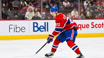 Sep 30, 2023; Montreal, Quebec, CAN; Montreal Canadiens left wing Juraj Slafkovsky (20) plays the puck against the Toronto Maple Leafs during the second period at Bell Centre. Mandatory Credit: David Kirouac-USA TODAY Sports