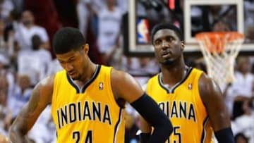 May 30, 2014; Miami, FL, USA; Indiana Pacers forward Paul George (left) and teammate center Roy Hibbert (right) react during a game against the Miami Heat in game six of the Eastern Conference Finals of the 2014 NBA Playoffs at American Airlines Arena. Mandatory Credit: Steve Mitchell-USA TODAY Sports