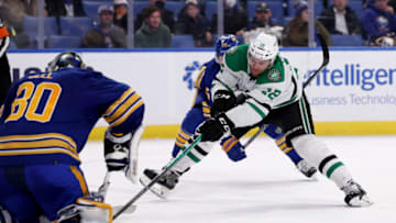 Jan 20, 2022; Buffalo, New York, USA; Buffalo Sabres goaltender Aaron Dell (80) makes a save on Dallas Stars center Radek Faksa (12) during the third period at KeyBank Center. Mandatory Credit: Timothy T. Ludwig-USA TODAY Sports