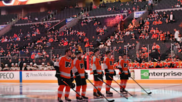 Oct 4, 2021; Philadelphia, Pennsylvania, USA; Philadelphia Flyers defenseman Ivan Provorov (9), defenseman Ryan Ellis (94), center Sean Couturier (14), left wing Joel Farabee (86), and right wing Travis Konency (11) stand during national anthem against the Boston Bruins at Wells Fargo Center. Mandatory Credit: Eric Hartline-USA TODAY Sports