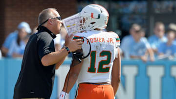 CHAPEL HILL, NC - OCTOBER 28: Head coach Mark Richt talks with Malik Rosier