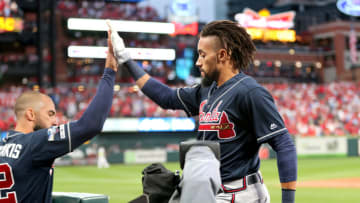 ST LOUIS, MISSOURI - OCTOBER 06: Billy Hamilton #9 of the Atlanta Braves is congratulated by his teammate Nick Markakis #22 after scoring a run to tie the game against the St. Louis Cardinals during the ninth inning in game three of the National League Division Series at Busch Stadium on October 06, 2019 in St Louis, Missouri. (Photo by Jamie Squire/Getty Images)