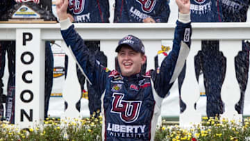 Jul 30, 2016; Long Pond, PA, USA; NASCAR Camping World Truck Series driver William Byron celebrates in victory lane after winning the Pocono Mountains 150 at Pocono Raceway. Mandatory Credit: Matthew O