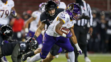 East Carolina Pirates running back Keaton Mitchell runs with the ball against Cincinnati Bearcats linebacker Brody Ingle. USA Today.