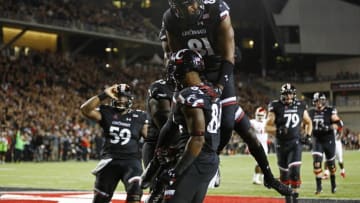 Sep 15, 2016; Cincinnati, OH, USA; Cincinnati Bearcats tight end DJ Dowdy (81) reacts to a touchdown by wide receiver Nate Cole (bottom) against the Houston Cougars in the second half at Nippert Stadium. Houston won 40-16. Mandatory Credit: Aaron Doster-USA TODAY Sports