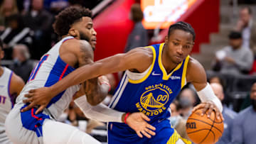 Golden State Warriors forward Jonathan Kuminga (00) gets defended by Detroit Pistons forward Saddiq Bey Credit: Raj Mehta-USA TODAY Sports