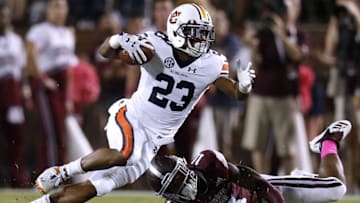 STARKVILLE, MS - OCTOBER 06: Ryan Davis #23 of the Auburn Tigers runs with the ball as Jaquarius Landrews #11 of the Mississippi State Bulldogs defends during the first half at Davis Wade Stadium on October 6, 2018 in Starkville, Mississippi. (Photo by Jonathan Bachman/Getty Images)