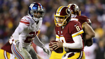 LANDOVER, MD - JANUARY 01: Quarterback Kirk Cousins #8 of the Washington Redskins is sacked by defensive back Leon Hall #25 of the New York Giants in the third quarter at FedExField on January 1, 2017 in Landover, Maryland. (Photo by Patrick Smith/Getty Images)
