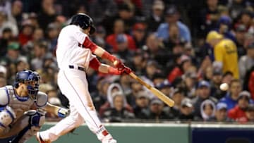 BOSTON, MA - OCTOBER 23: Andrew Benintendi #16 of the Boston Red Sox hits a single during the fifth inning against the Los Angeles Dodgers in Game One of the 2018 World Series at Fenway Park on October 23, 2018 in Boston, Massachusetts. (Photo by Maddie Meyer/Getty Images)