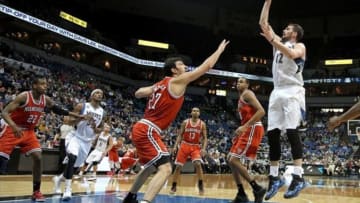Mar 11, 2014; Minneapolis, MN, USA; Minnesota Timberwolves forward Kevin Love (42) shoots over Milwaukee Bucks center Zaza Pachulia (27) during the fourth quarter at Target Center. The Timberwolves defeated the Bucks 112-101. Mandatory Credit: Brace Hemmelgarn-USA TODAY Sports