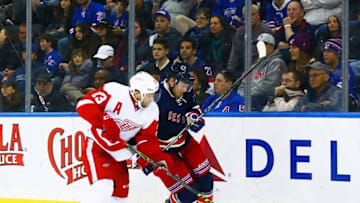 Feb 21, 2016; New York, NY, USA; Detroit Red Wings center Pavel Datsyuk (13) and New York Rangers left wing Viktor Stalberg (25) battle for a loose puck during the second period Madison Square Garden. Mandatory Credit: Andy Marlin-USA TODAY Sports