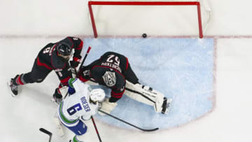 Jan 15, 2023; Raleigh, North Carolina, USA; Vancouver Canucks right wing Brock Boeser (6) scores a goal past Carolina Hurricanes goaltender Pyotr Kochetkov (52) during the third period at PNC Arena. Mandatory Credit: James Guillory-USA TODAY Sports