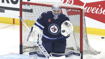 Apr 22, 2023; Winnipeg, Manitoba, CAN; Winnipeg Jets goaltender Connor Hellebuyck (37) warms up before a game against the Vegas Golden Knights in game three of the first round of the 2023 Stanley Cup Playoffs at Canada Life Centre. Mandatory Credit: James Carey Lauder-USA TODAY Sports
