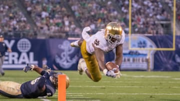 SAN DIEGO, CA - OCTOBER 27: Notre Dame Fighting Irish running back Dexter Williams (2) dives for a touchdown during a NCAA football game between the Notre Dame Fighting Irish and the Navy Midshipmen on October 27, 2018, at SDCCU Stadium in San Diego, CA. (Photo by Justin Fine/Icon Sportswire via Getty Images)