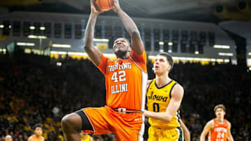 Illinois forward Dain Dainja (42) shoots the ball as Iowa forward Filip Rebraca (0) defends during a NCAA Big Ten Conference men's basketball game, Saturday, Feb. 4, 2023, at Carver-Hawkeye Arena in Iowa City, Iowa.230204 Illinois Iowa Mbb 008 Jpg