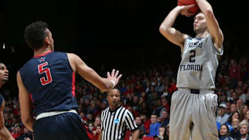 Mar 18, 2015; Dayton, OH, USA; North Florida Ospreys guard/forward Beau Beech (2) shoots over Robert Morris Colonials forward Elijah Minnie (5) during the second half in the first round of the 2015 NCAA Tournament at UD Arena. Mandatory Credit: Brian Spurlock-USA TODAY Sports