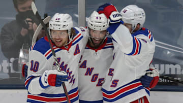 Apr 9, 2021; Uniondale, New York, USA; New York Rangers center Colin Blackwell (43) celebrates his goal against the New York Islanders with left wing Artemi Panarin (10) and center Ryan Strome (16) during the second period at Nassau Veterans Memorial Coliseum. Mandatory Credit: Brad Penner-USA TODAY Sports