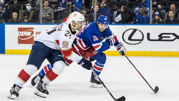 NEW YORK, NY - NOVEMBER 10: Florida Panthers Center Vincent Trocheck (21) takes the puck towards the net during an Eastern Conference match-up between the Florida Panthers and the New York Rangers on November 10, 2019, at Madison Square Garden in New York, NY. (Photo by David Hahn/Icon Sportswire via Getty Images)