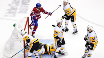 TORONTO, ONTARIO - AUGUST 07: Artturi Lehkonen #62 of the Montreal Canadiens celebrates his goal as Tristan Jarry #35,Justin Schultz #4,Kris Letang #58,Teddy Blueger #53 and Zach Aston-Reese #46 of the Pittsburgh Penguins look on in the third period in Game Four of the Eastern Conference Qualification Round prior to the 2020 NHL Stanley Cup Playoffs at Scotiabank Arena on August 07, 2020 in Toronto, Ontario. (Photo by Andre Ringuette/Freestyle Photo/Getty Images)