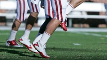 NORMAN, OK - OCTOBER 1: Players from the Oklahoma Sooners warm up before the game against the Ball State Cardinals on October 1, 2011 at Gaylord Family-Oklahoma Memorial Stadium in Norman, Oklahoma. Oklahoma defeated Ball State 62-6. (Photo by Brett Deering/Getty Images)