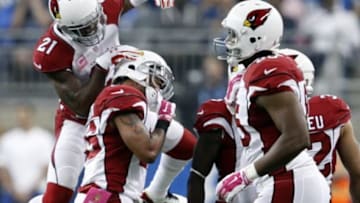 Oct 11, 2015; Detroit, MI, USA; Arizona Cardinals cornerback Patrick Peterson (21) congratulates free safety Rashad Johnson (26) after making a turnover during the second quarter against the Detroit Lions at Ford Field. Mandatory Credit: Raj Mehta-USA TODAY Sports