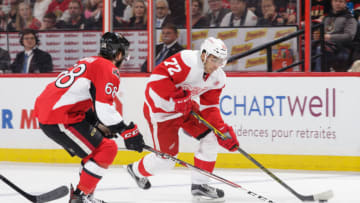 OTTAWA, ON - DECEMBER 29: Andreas Athanasiou #72 of the Detroit Red Wings skates with the puck against Mike Hoffman #68 of the Ottawa Senators at Canadian Tire Centre on December 29, 2016 in Ottawa, Ontario, Canada. (Photo by Jana Chytilova/Freestyle Photography/Getty Images) *** Local Caption ***