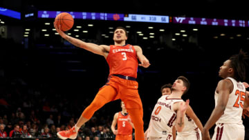 Mar 9, 2022; Brooklyn, NY, USA; Clemson Tigers guard Chase Hunter (3) drives to the basket against Virginia Tech Hokies guard Hunter Cattoor (0) during overtime at Barclays Center. Mandatory Credit: Brad Penner-USA TODAY Sports