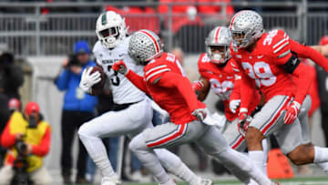 COLUMBUS, OH - NOVEMBER 11: LJ Scott #3 of the Michigan State Spartans takes off on a 20-yard run in the first quarter against the Ohio State Buckeyes at Ohio Stadium on November 11, 2017 in Columbus, Ohio. (Photo by Jamie Sabau/Getty Images)
