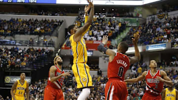 Dec 10, 2016; Indianapolis, IN, USA; Indiana Pacers forward Paul George (13) takes a shot against Portland Trail Blazers guard Damian Lillard (0) at Bankers Life Fieldhouse. Indiana defeats Portland 118-111. Mandatory Credit: Brian Spurlock-USA TODAY Sports